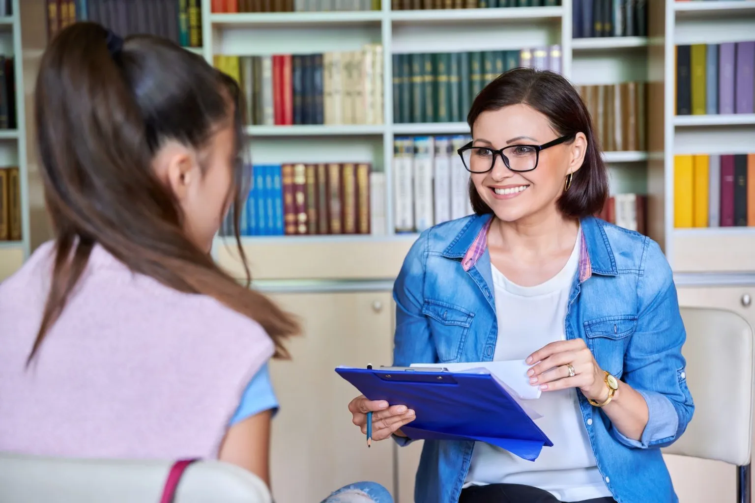 Counselor speaking with a teen client